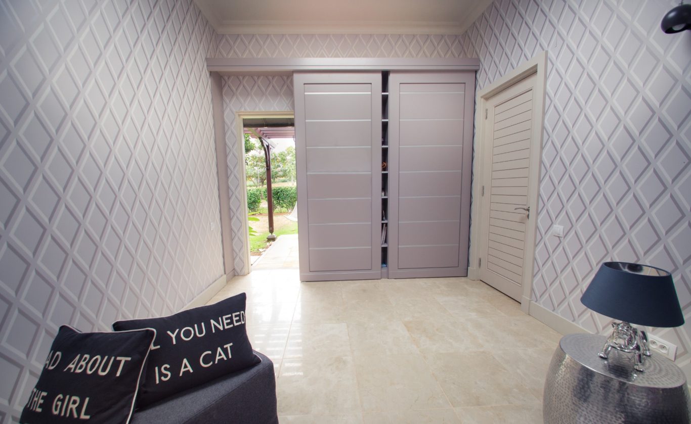 Bespoke joinery concealing private exit. Residential home.